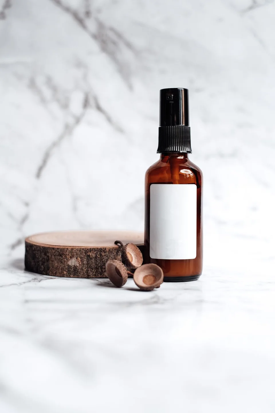 Real photograph of an amber spray bottle with a blank label