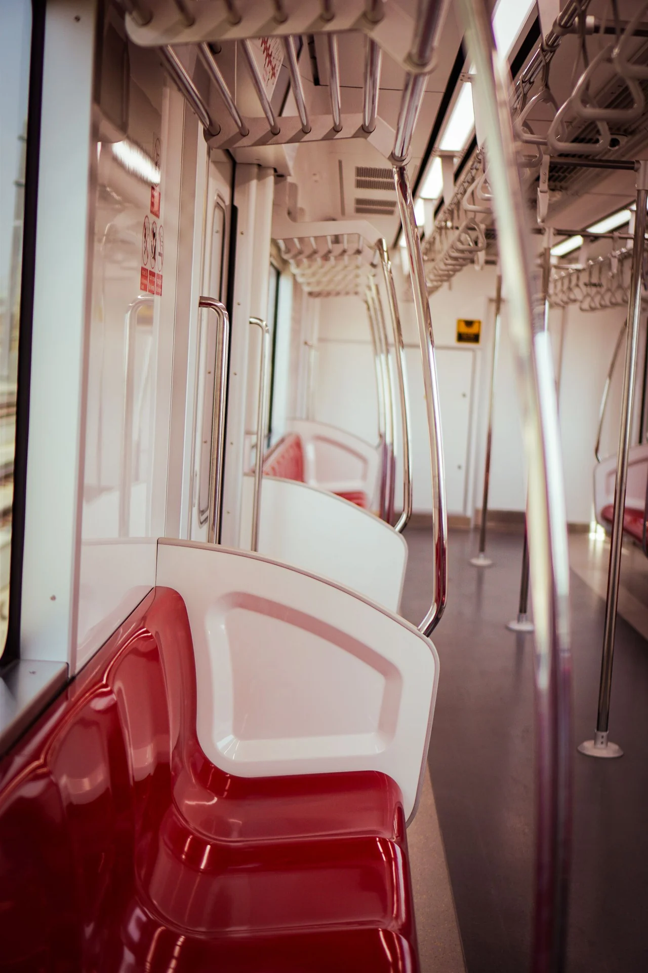 Real metro cabin with passenger seating and overhead air conditioning, shown as a setting example
