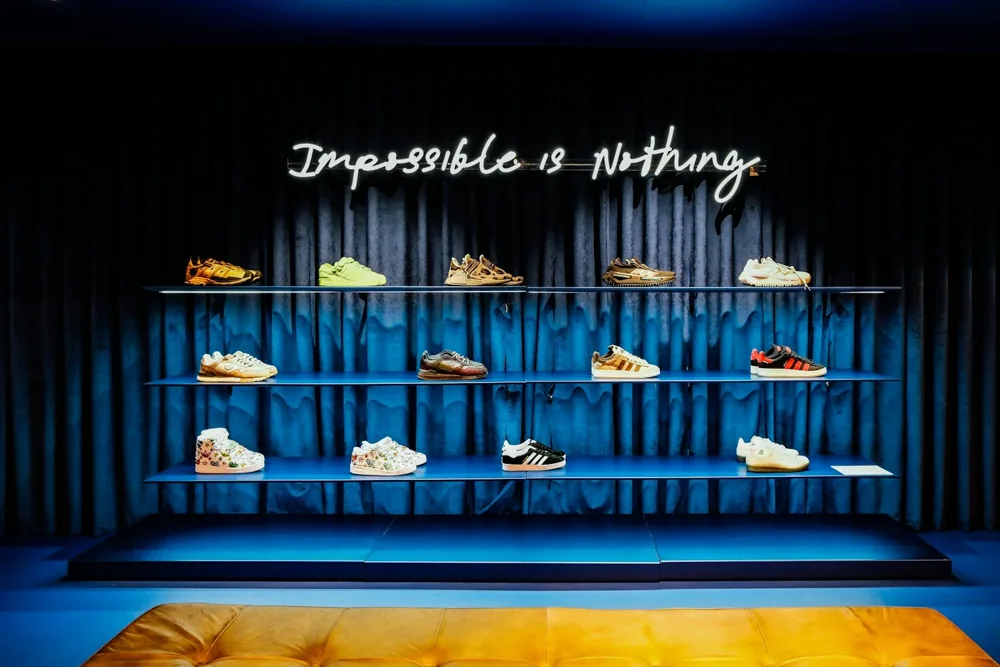 Athletic shoes displayed on shelves in a sports shop