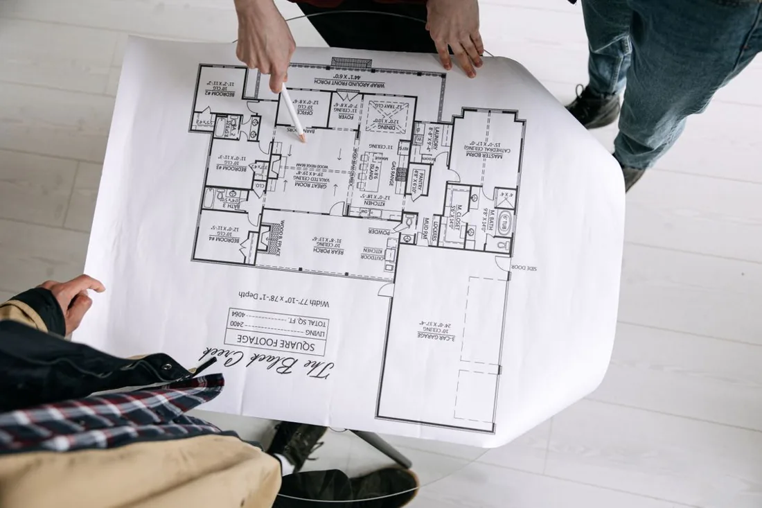 People reviewing floor plans together