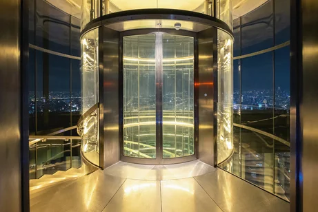 A glazed lift within a commercial interior